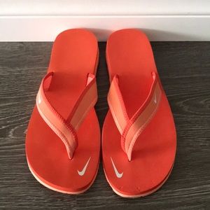 orange nike flip flops